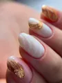Macro shot of oval press-on nails with white base, gold foil, and pearlescent finish - Bz1598 Gold Flakes And Jade Fingers / Handmade Nail Art Size Xs (10 Pieces)