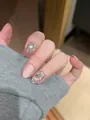 Detailed view of nude pink and silver glitter press-on nails with shiny rhinestone accents - By2065 / Handmade Nail Art Size M 10 Pieces/bag [tool Kit Included]