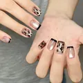 Detailed view of long square press-on nails with leopard print and black French tips - Full Size Plate / Gold Glitter Leopard Print Style (BY1816)
