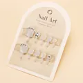Silver glitter and milky white press-on toenails with diamond accents on cardboard - Tool Kit Style (ZF80)