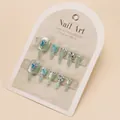 Luxurious sage green press-on toenails with sparkling blue rhinestones and glitter finish - Glue Type