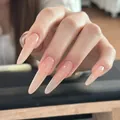 Long stiletto press-on nails with nude pink gradient and glossy jelly finish on hand - Boxed Version (BY2246 Vivid)