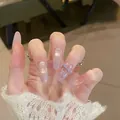 Macro detail of long almond press-on nails with lilac gradient and 3D bow accent - 30 Pcs/Box / Purple Gradient Bow (BY2223)