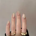 Unghie finte corte ovali color champagne con effetto occhi di gatto e glitter dorati - 30 Pezzi/Scatola / Bordo Oro (Nude Perlato)