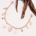 Golden starfish seashell charm bracelet with beach ocean themed metal link chain design - Conch Bag Chain