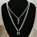 Double-layered silver necklace with vintage key and padlock pendants on a display stand - Style 2 (Double Layer Key Lock Necklace) / Silver