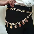 Women's gold chunky chain belt featuring vintage queen coin charms on a black outfit - Gold