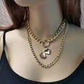Collana dorata a doppio strato con medaglione a cuore vintage e pendente a cerchio - Oro