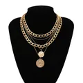 Vintage multi-layer gold necklace featuring coin pendants and curb chain on a black bust - Multi-Layer Necklace Gold