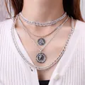 Retro multilayer silver Cuban chain necklace set with vintage coin pendant on white knitwear - Silver