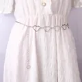 Silver multi-layered heart-shaped metal waist chain on a white dress for punk hip-hop style - Heart Hollow-out Waist Chain