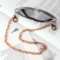 Detail of amber acrylic glasses chain with lobster clasps and anti-slip silicone loops - Coffee