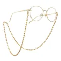 Goldene runde Metallbrille mit glitzernder Strasskette auf weißem Hintergrund - Gold