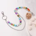 Dettaglio di pendenti a stella colorati in conchiglia su una catena da vita argento - Stella Conchiglia