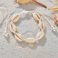 Bracelet tressé en coquillages pour femme sur sable blanc avec décorations d'étoiles de mer - Style Perle Corde Blanche / Corde Blanche avec Perle