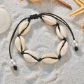 Bracelet coquillage bohème en nacre naturelle avec cordon noir ajustable sur le sable - Style Perle Corde Noire / Corde Noire avec Perle