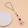 Pink mushroom pendant chain with evil eye beads and flower charms on a lobster clasp - Pink