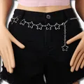 Silver star chain belt with hollow pentagram links and adjustable lobster clasp on denim shorts - Silver