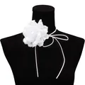 Close-up of a white fabric flower choker with long ribbon ties on a black mannequin - White