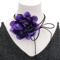 Close-up of handmade 3D purple silk flower choker with long black adjustable neck ties - Purple