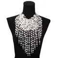 Luxurious multi-layer pearl fringe choker necklace with rhinestone accents on a black bust - Silver