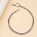 Detail of silver Cuban link pant chain with cross pendant and spring lobster clasps - Circle Style