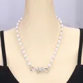Punk style pearl necklace with silver barbed wire cross pendant on model mannequin - Pearl Barbed Wire Necklace