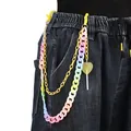 Detail of colorful acrylic rainbow pants chain with translucent heart pendant on denim - Yellow Lollipop Double Chain