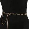 Elegant gold heart waist chain belt with rhinestones on black mannequin model - Gold