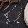 Macro view of silver boot chain featuring butterfly pendants and lobster clasps - Silver Butterfly Shoe Chain (sp-806)