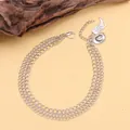 Detailed silver triple-layer shoe chain featuring cowboy boot and crystal hat pendants - Silver