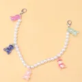 Close-up of pearl bead chain with five colorful resin bears and silver lobster clasps - Beaded Bear Shoe Chain