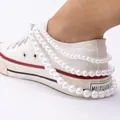 Multi-layer pearl shoe chain accessory with stainless steel clasp on white canvas shoes - Triple Layer Pearl