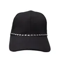 Close-up of a silver heart-shaped metal chain on a black baseball cap detail - Heart Chain Hat Chain