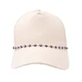 Detail of evil eye charm chain on a stylish cream cotton baseball cap with stitch detail - Dark Blue