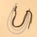 Detail der mehrlagigen Hip-Hop-Hosenkette mit silbernen Gliedern und braunem Flechtseil - Braunes Seil Silberne Kette