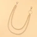 Detail view of double-layer gold Cuban link pants chain with lobster clasp and ring - Gold