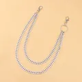 Detail of silver double-layered metal curb chains with lobster clasps for trousers - Silver