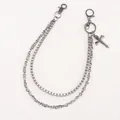 Close-up of a dual-layer gunmetal trousers chain featuring a dragonfly punk pendant - Skull Cross / Vintage Silver