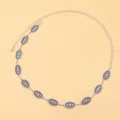 Macro detail of vintage silver metal waist chain with embossed oval pattern links - Antique Silver Embossed Style (y4-y602)