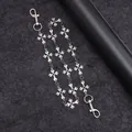 Detail of silver metal pant chain featuring vintage cross links and lobster clasps - Iris Pattern Cross D-Buckle Style