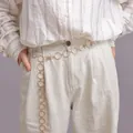 Fashionable gold circular link waist chain worn over casual striped shirt and beige pants - Single Layer Circular Ring / Gold