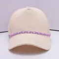 Beige cotton baseball cap featuring a trendy light purple chain link accessory on the brim - Purple