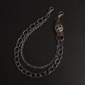 Detail of vintage leather cross accent and layered heavy metal biker wallet chains - Brown Cowhide Cross Large Ring Style
