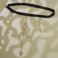 Detail of bohemian gold leaf pendants on multi-layered leg chains with black elastic band - Gold Leaf Tassel Leg Chain