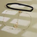 Detail of black elastic leg chain with golden cobra pendant and adjustable metal link chain - Gold Snake Pendant Leg Chain