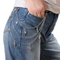Detail of layered silver metal pant chain with polished star charms on denim jeans - Starburst Pants Chain