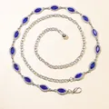 Close-up of elegant silver belt chain with marquise-cut deep blue rhinestones - Blue Gemstone