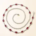 Macro shot of silver waist chain with marquise ruby stones and sparkling rhinestones - Red Gemstone