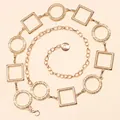 Detail view of gold geometric chain belt with lobster clasp and textured links - Gold